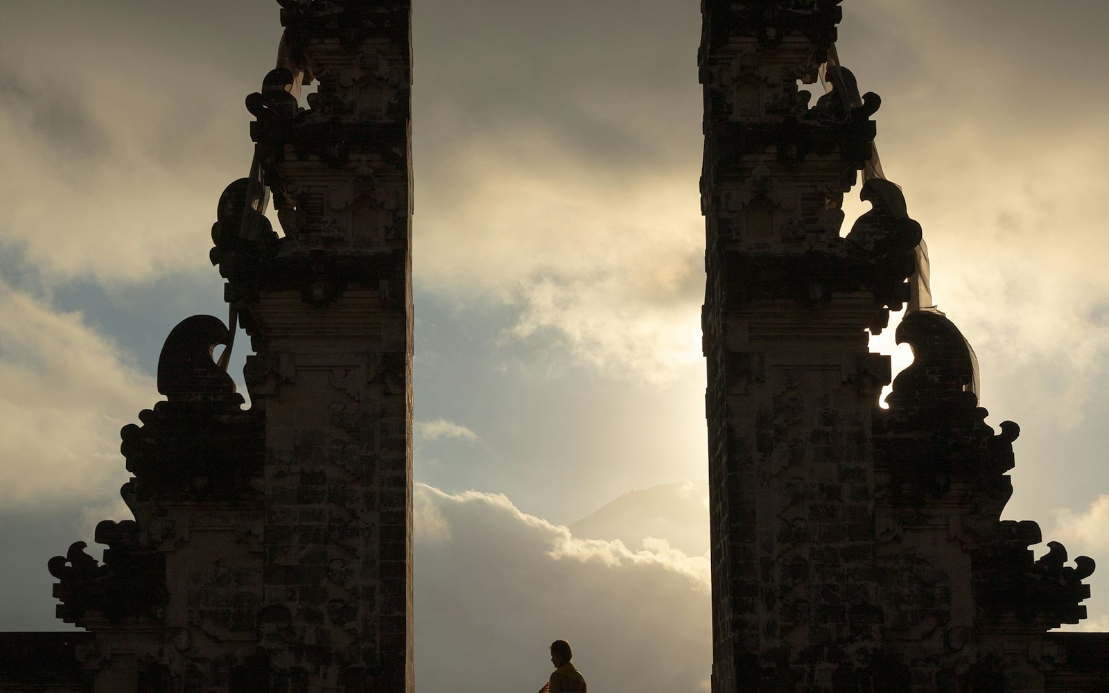 Traveller standing in a Balinese temple gateway
